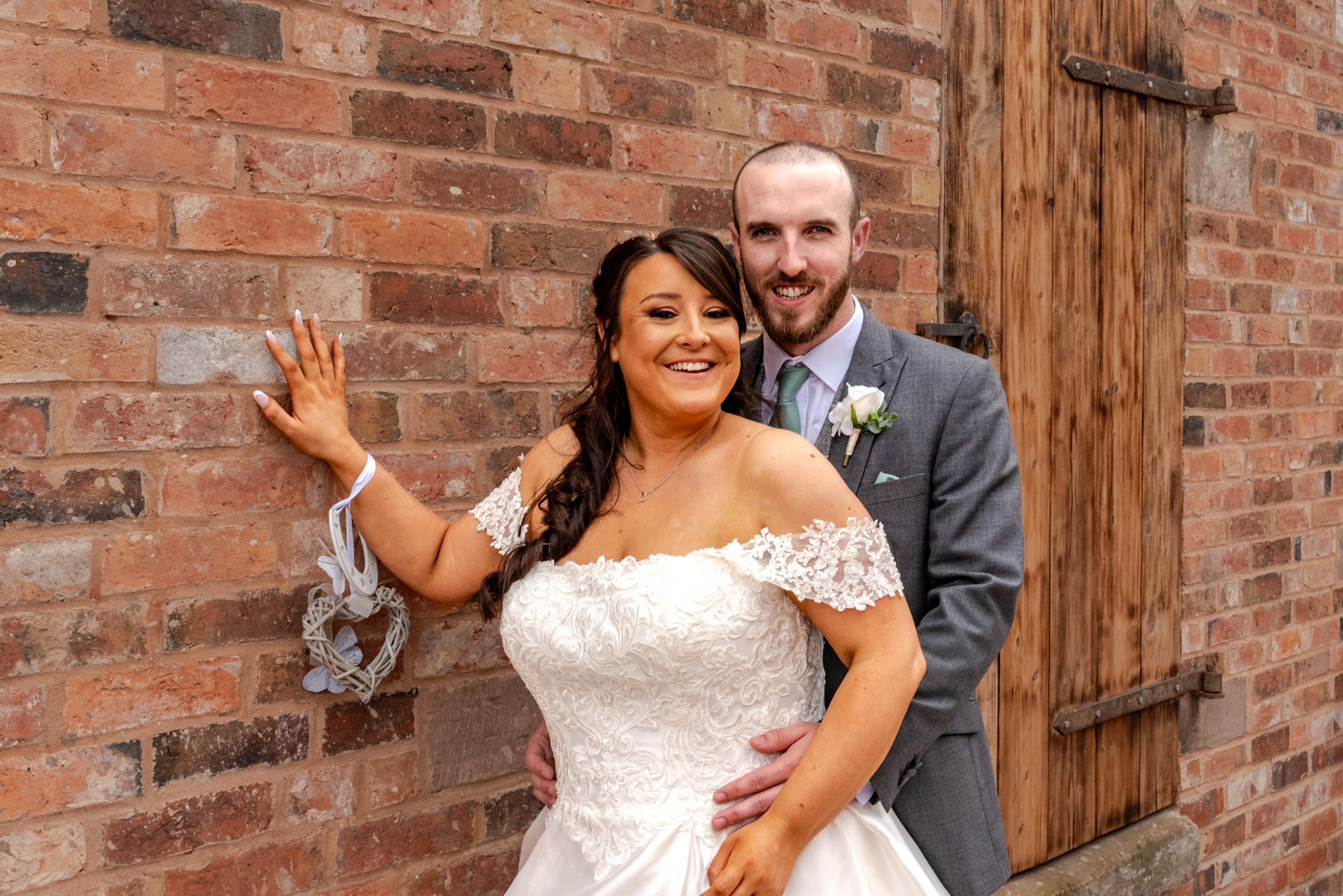 Bride and Groom posed outside at The Barns Hotel Cannock