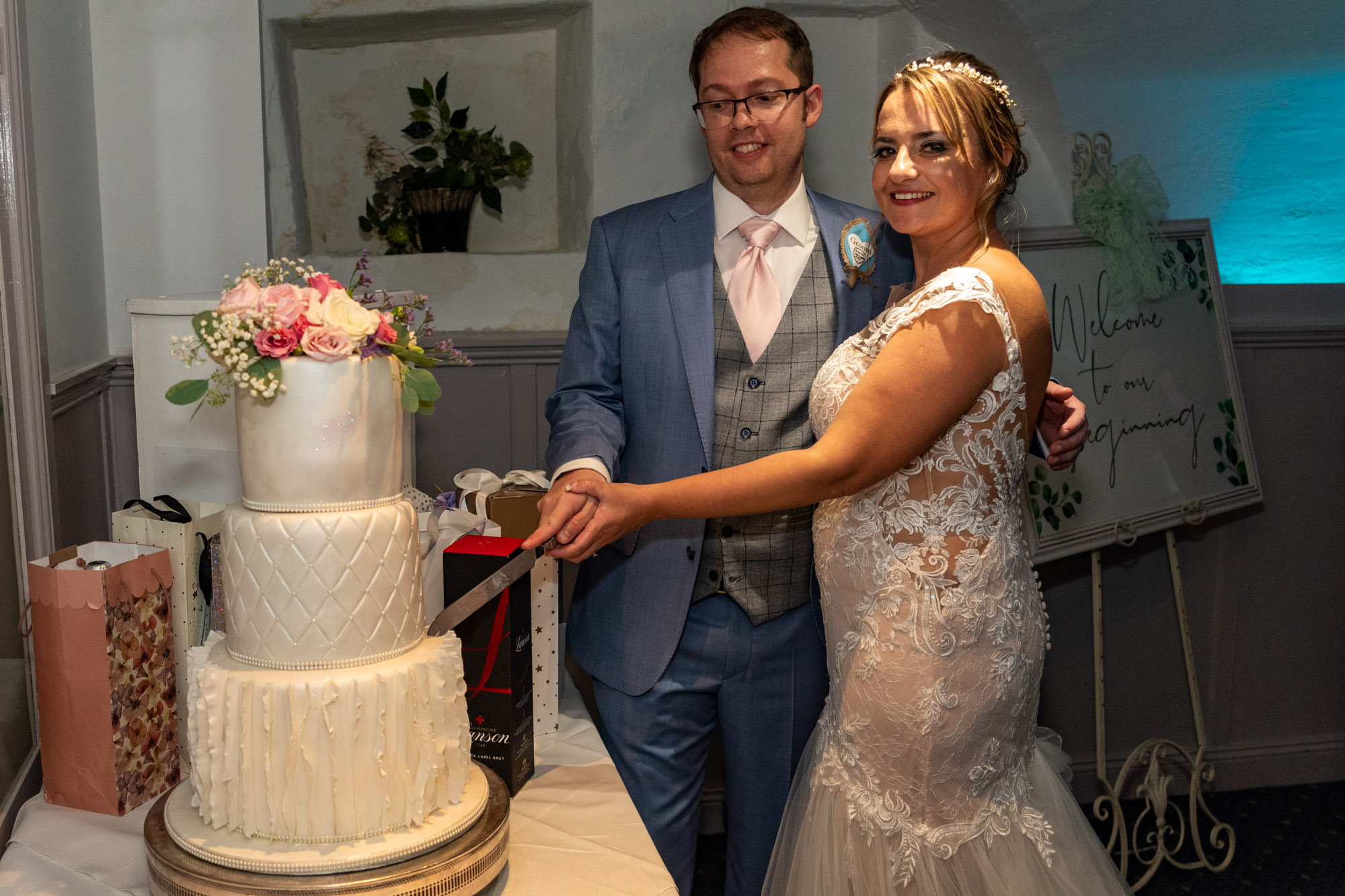 Bride and groom cutting cake at Waterton Park Hotel in Wakefield